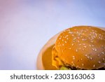 A large burger served on a...