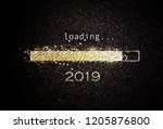 Computer screen with loading bar counting down for New Years Eve 2019 with sparkling glitter and copy space over black