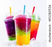 stock-photo-still-life-close-up-of-colorful-rainbow-layered-frozen-fruit-slush-drinks-arranged-on-ice-covered-401283526.jpg