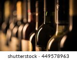 Row of vintage wine bottles in...