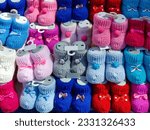 
Handmade colorful knitted baby booties.Baby concept
