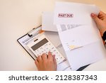 Small photo of The homeowner receives debt letters as a concept of rising delinquent debts, higher prices, and lower incomes.