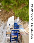 Small photo of Typical blue chairs at the terrace of a local tavern annex cafe on the Greek island Karpathos, in the small village Lefkos
