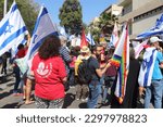 Small photo of Tel Aviv, Israel - May 4, 2023: Demonstrators rallied in front of The Rabbinical Court, 33 King David Boulevard, protesting against the judicial reform. Star of David.