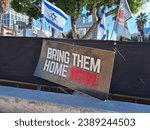 Small photo of Tel Aviv, Israel - November 15, 2023: Campaign to release the Israeli hostages, kidnapped by Hamas. Tel Aviv Museum of Art Square. Bring Them Home Now sign.