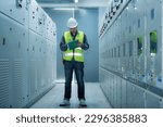 Small photo of electrician working in a factory. electrician at work. electrician working in a power station. engineer working on the checking status switchgear electrical energy distribution substation.