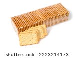 Packing cookies on a white background. Biscuits in plastic packaging. In the foreground are cookies without packaging.