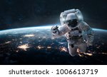 Astronaut In Outer Space Over...