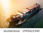 Container ship transporting large cargo logistic to import export goods internationally around the world, including Asia Pacific and Europe, by sea or Mediterranean sunlight rays Aerial view photograp