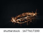  The crown of thorns of Jesus upon holy bible on black  background with copy space, can be used for Christian background, Easter concept