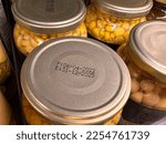 Small photo of Closeup image of production and expiry dates on canned food (kernel corn)