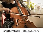 A Female Musician Playing The...