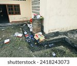 Small photo of Talibura, Flores, Indonesia - January 28 2024 : Scattered rubbish resulting from food and soft drink packaging, rubbish strewn in the yard, household rubbish