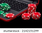 Gambling online casino Internet betting concept. Jackpot, casino chips. computer keyboard, laptop with poker chips, dice. Casino tokens, gaming chips, checks, or cheques.