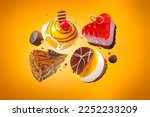 Various levitating cakes with fruit jelly chocolate decoration. Exquisite Fresh delicious floating mousse dessert on colored background