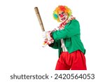 Small photo of Bad, angry clown club-swinging. Horrible Halloween Joker in colorful suit and wig. Buffoon with clown whiteface makeup. Trickster, jester