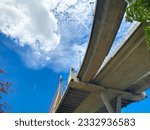 Small photo of Under the bridge, stubby pylons, the expressway bridge is built from steel and solid cement. Use up and down across the river, park, meandering back and forth and planning to travel in city concept.