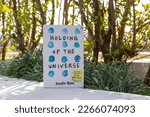 Small photo of Setif, Algeria - February 22, 2023: Close up Jennifer Niven's Holding Up the Universe book in the garden.