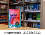 Small photo of Setif, Algeria - October 07, 2023: Close up Taylor Jenkins Reid's Malibu Rising novel in the bookshop.