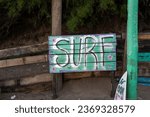 Small photo of Quequen, Argentina, January 10, 2023: cartel de escuela de surf school in Monte Pasubio.