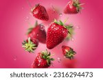 fresh strawberries in bulk with water drops in the air. food levitation.