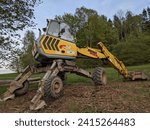 Small photo of Brno, Czech republic- January 20, 2024: Forest digger Menzi Muck A91 in the forestduring earthworks.