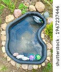 A Small Garden Pond With...