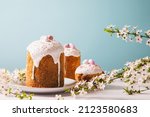 Easter cake with glace icing and decoration. Postcard with Easter bread. Christian traditions. Copy space. White background
