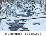 A Snow Covered Stream In The...