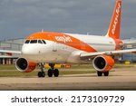Small photo of Manchester Airport, United Kingdom - 10 June 2022: Easyjet Airbus A320 (G-EZRY) entering runway 23L for take off to Gatwick.