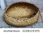 Small photo of Cofo, straw basket made with leaves taken from the babassu tree, a utilitarian artisanal artifact from the culture of simple men in the interior of Brazil.