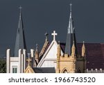 Two Spires With Crosses And...