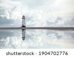 Lighthouse standing pool of water stunning dramatic storm clouds reflection reflected water sea Holywell Talacre Ayr Wales seashore sand beach still water blue hour flying birds stormy weather ocean