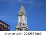 Small photo of Boston, MA, USA, 9.11.21 - Boston's famous Custom House Clock Tower standing high in the skyline. This skyscraper is located in McKinley Square and visible throughout the financial district.