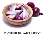 Sliced Red Onion in wooden bowl isolated on white background