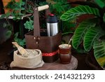 Small photo of Argentine mate, mate bag with thermos, glass, and handmade bag with yerba mate. Enjoying a hot drink in the garden.
