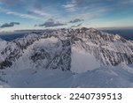 The High Tatras Mountains (Vysoke Tatry, Tatry Wysokie, Magas-Tatra), sunrise view with clear sky and first snow. View from the top of Kriváň