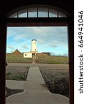 Small photo of Lighthouse at Piedras Blancas point as seen from inside fog signal building on the Central Coast of California USA