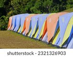 Small photo of NAN, THAILAND – NOVEMBER 11, 2022: Many tents for camping on the morning at the mountain in DOI always stars in SI Nan National Park Na Noi of Nan province.Popular tourist destinations for relaxing.