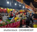 Small photo of Terengganu. February 11, 2024. The situation is busy when the seller serves customers at the food mania stall in Kuala Terengganu. The atmosphere is at night.