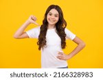 Small photo of Happy teenager, positive and smiling emotions of teen girl. Teenager child girl point thumb herself. Choose me. Girl pointing at herself.