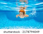 Child Swim Under Water In Sea....