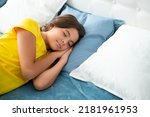 Small photo of Sleeping and dreaming kids. Kid lying and sleeping on bed. Child teen sleeps in the bed. Sleeper, napping concept.