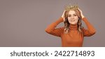 Small photo of Princess woman with crown. smiling blonde girl with curly hair wear crown, egoism. Woman portrait, isolated header banner with copy space.