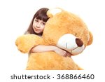 beautiful little girl holding a big teddy bear, isolated on white