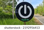 Small photo of August 23 ,2022 Ratchaburi, Thailand Black plastic sheet made into a circle sign. with white mark is an electric switch to tell travelers that there is a service point in front of them to plug in elec