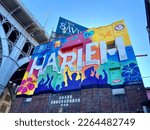 Small photo of New York, NY USA - October 21, 2021 : Colorful "Harlem" mural by graffiti artists Tats Cru next to the arches of the Riverside Drive Viaduct in West Harlem