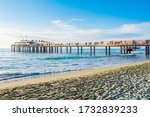 Versilia, Italy - Lido di Camaiore modern pier at sunset. Known for fashionable Riviera resorts, it consists of numerous clubs that are frequented by local celebrities.