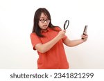 Small photo of Asian woman have suspicion on a phone, Looking a phone through magnifying glass. Isolated on white