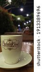 Small photo of East Java, Indonesia - February 7, 2021: A cup of hot chocolate served on the table against a blurred background in hapless Malang, Indonesia